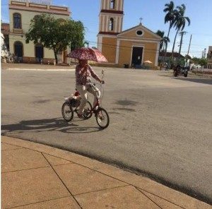 Cuba - Lady on a bike